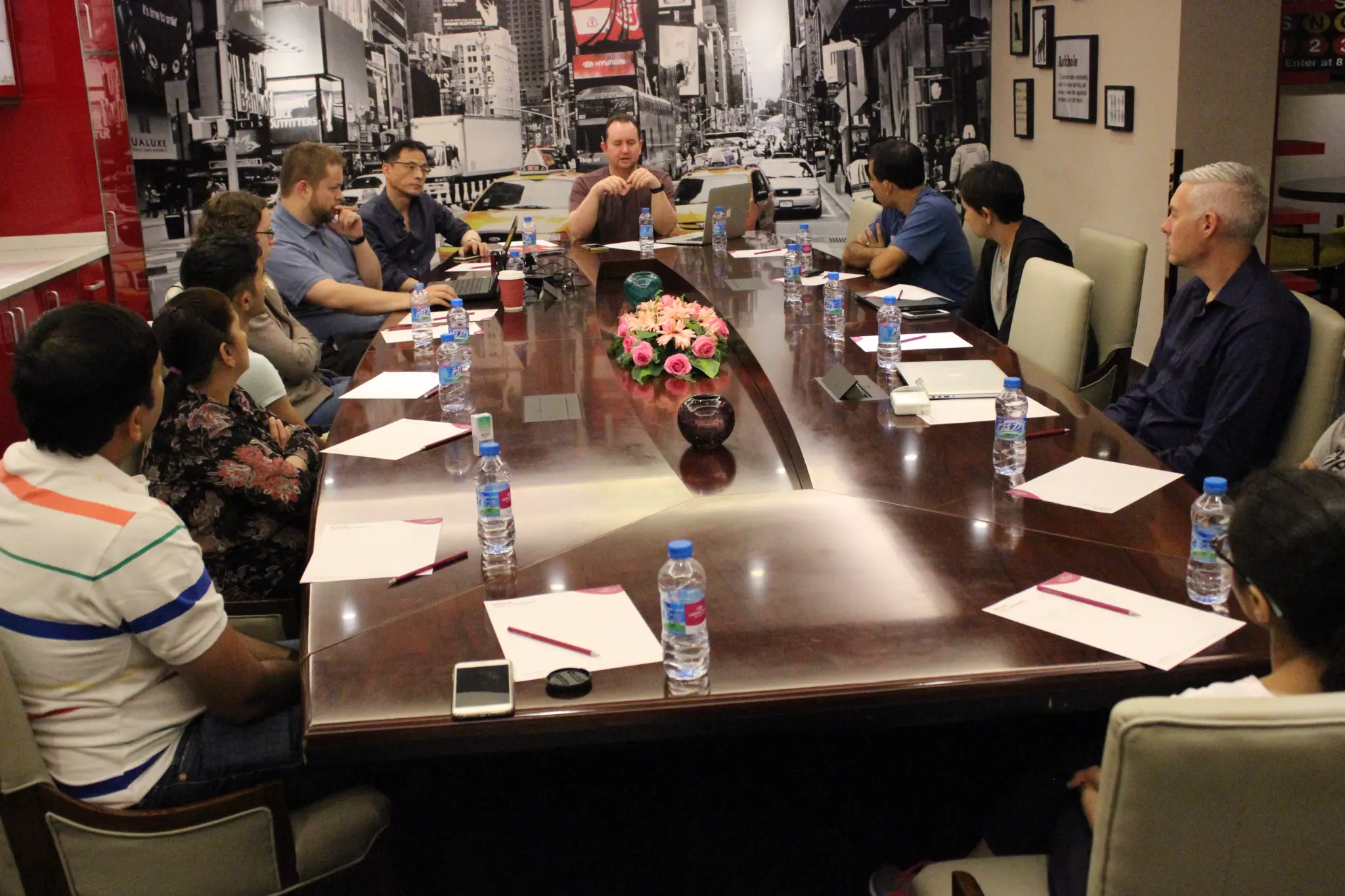SYMO Global team meeting — international entrepreneurs around a conference table